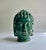 Mid Century perforated Meditative Pottery Buddha Head in reflective Green Glaze. Featuring a pierced pottery form of...
