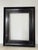 Elegant antique ebonized wooden picture frame featuring a deep black ebony-style finish with warm undertones and refined...