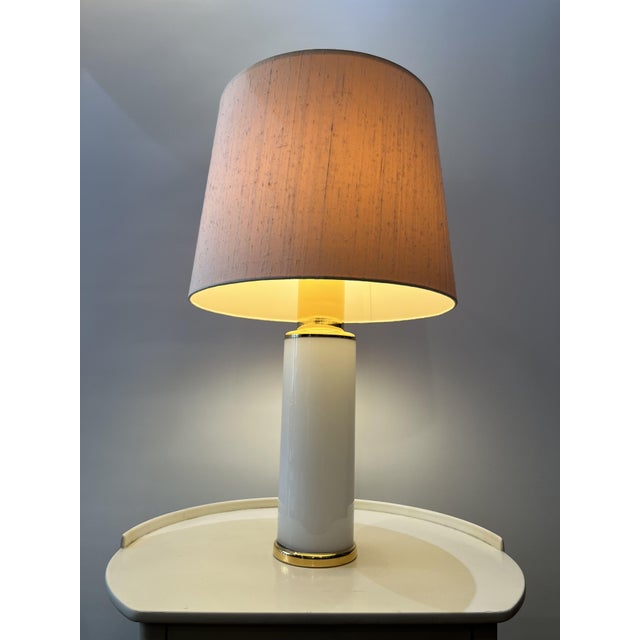 Elevate your living space with the Uno & Östen Kristiansson Glass Table Lamp, a stunning piece from Luxus, Sweden, crafted...