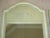 Beautiful pair of celery green painted wooden mirrors with decorative accent. Hanging hardware is attached.
