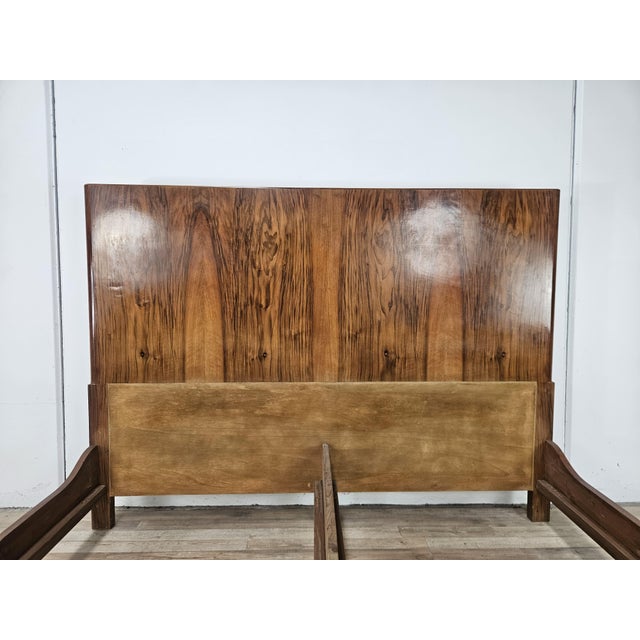 An elegant vintage Art Deco double bed dating back to the 1940s, crafted from walnut and featuring a frame with clean,...