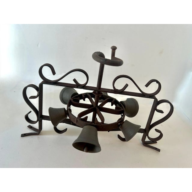 A wonderfully unique door, entry or reminder bell. A succession of hand wrought bells in a circular motion, when rotated...