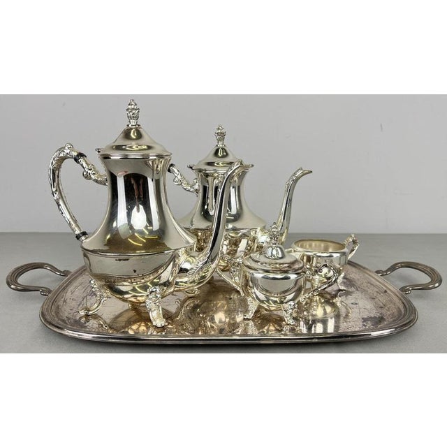 An elegant Vintage French coffee set comprising a tea pot, coffee pot, milk pot, sugar box and handled serving tray, all...