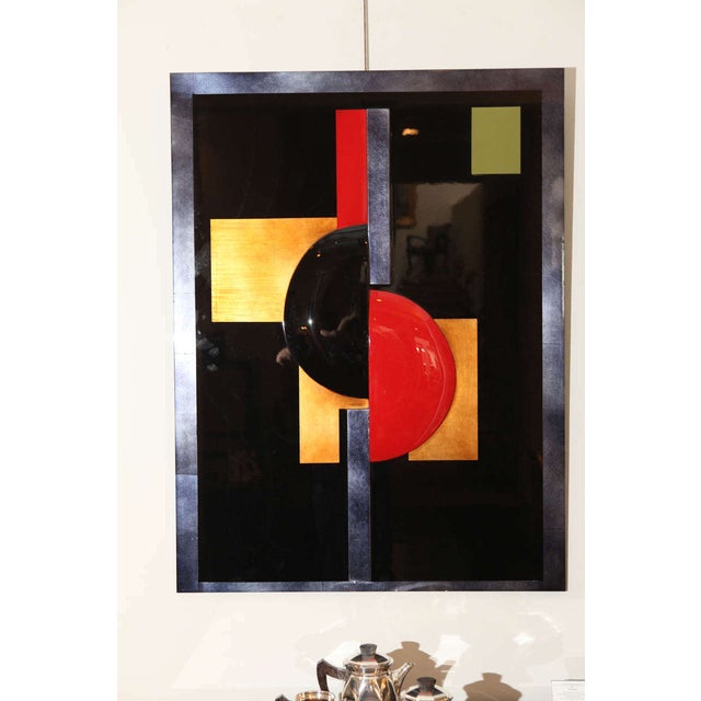 This bold panel by German artist Eliade Ispas features red and black lacquer as well as gold and silver leaf accents. It...