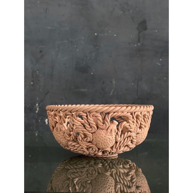 Beautiful hand made raw terracotta fruit bowl with rope and fruit design. Italian made by Dept. 56. marked on bottom.