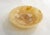 Large, round, flat trinket dish made entirely of marbled beige ochre onyx stone