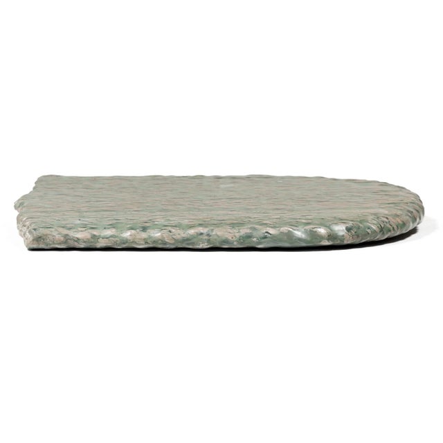 This expansive stone slab is formed of zhenzhu stone, a conglomerate limestone extracted from Lake Tai in Jiangsu...