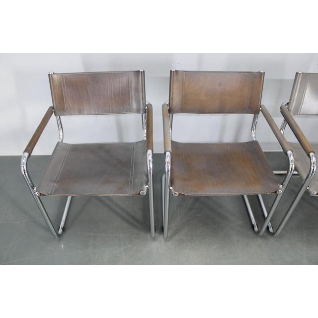 This refined set of four Bauhaus cantilever armchairs, attributed to Mart Stam, was produced in Italy in the 1980s....