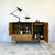 Solid elm construction on turned legs with stretcher rail base. Exposed finger-jointed corners throughout. Three framed-...
