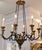 Gold and black Italian Giltwood and iron chandelier by Randy Esada Designs for Prospr. This lovely chandelier is a...