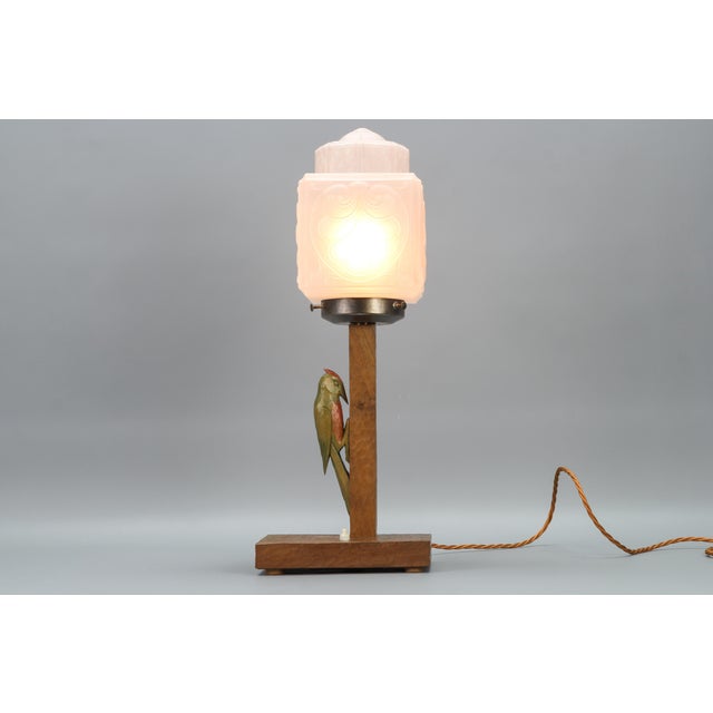This large and beautiful art deco period table lamp features an ornate white frosted glass lampshade and hand-carved...