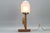 This large and beautiful art deco period table lamp features an ornate white frosted glass lampshade and hand-carved...