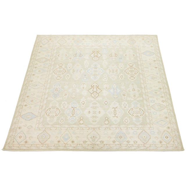 Elevate your space with this exquisite Modern Oushak Style rug, hand-knotted from premium wool. Its blend of geometric...