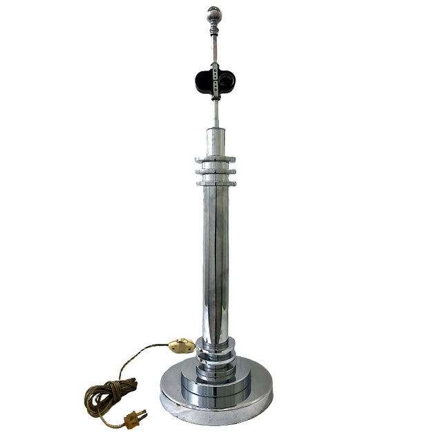 This striking pair of Art Deco style chrome table lamps showcases the sleek, geometric characteristics that defined the...
