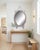 A truly exquisite mother-of-pearl inlaid mirror, masterfully crafted to showcase timeless artistry. Its exotic oval...