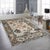 A hand-knotted wool rug, made in India and measuring 8' x 10'. Floral drawing carried across the field inside a...