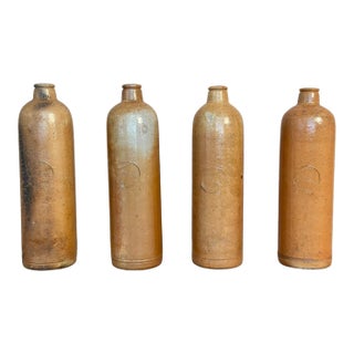 Set of Four Antique Stoneware Bottles For Sale