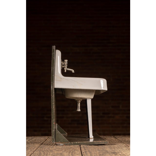 Miniature porcelain and enameled metal salesman sample sink display featuring a wall-mount style utility basin with...