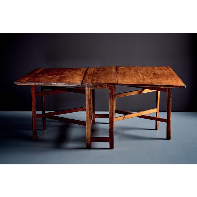 Swedish pine table with two folding leaves, offering a flexible and practical design. Total width 170cm (center plank 34...