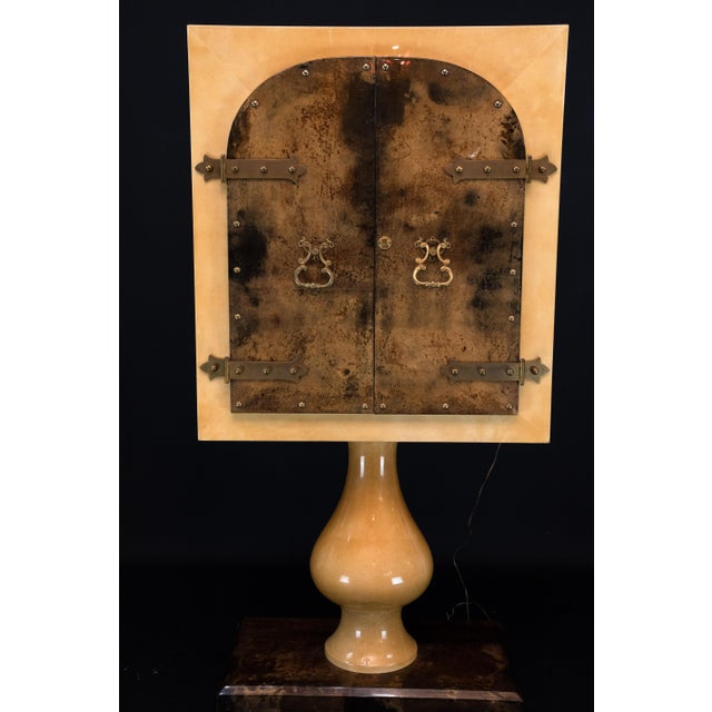 A striking dry bar cabinet by Italian master designer Aldo Tura, crafted in his signature lacquered goatskin parchment....