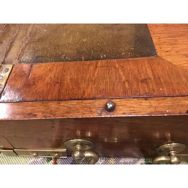 English Regency mahogany travelling sloped lap desk box with brass corner mounts and handles, 19th century. Key included....