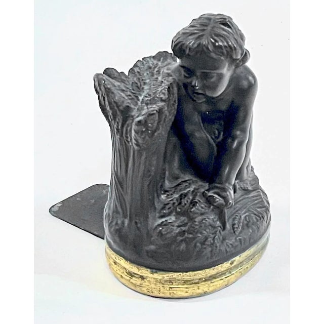 Vintage bronze child harvesting wheat bookend. Also would a beautiful paperweight or decorative object. Marked "Borghese"...