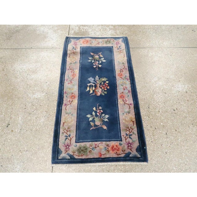 An antique Chinese Art Deco throw rug handmade during the early 20th century. Measures: 2' 0" x 3' 9".