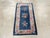 An antique Chinese Art Deco throw rug handmade during the early 20th century. Measures: 2' 0" x 3' 9".