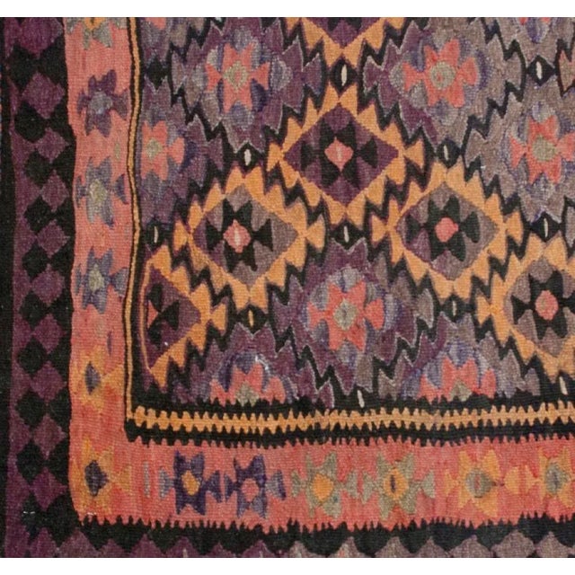 An early 20th Century Persian Qazvin kilim rug with all-over geometric "criss-cross" pattern with a charming and...