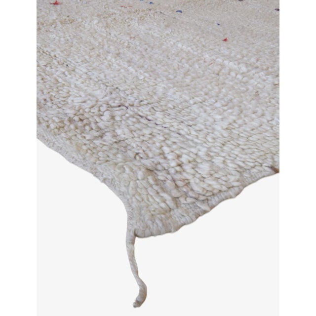 Discover the Kilim Beni Ourain Square Rug, a rare off-white treasure measuring 6.1 by 6 feet. This exquisite piece blends...