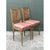 Crafted in Sweden, this elegant pair of vintage side chairs showcases classic Gustavian and Neoclassical design...