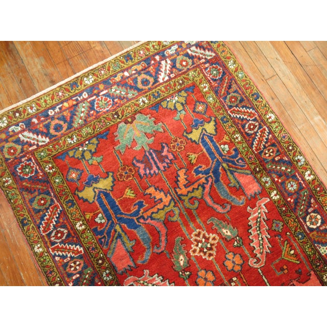 An early 20th Century Wide Antique Persian Heriz Jewel Toned Runner. Professionally Cleaned and able to endure heavy...