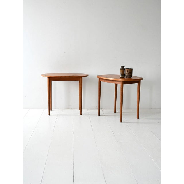 Pair of oval teak coffee tables designed by Yngvar Sandström for Säffle Möbelfabrik, Sweden. The edge features a refined...
