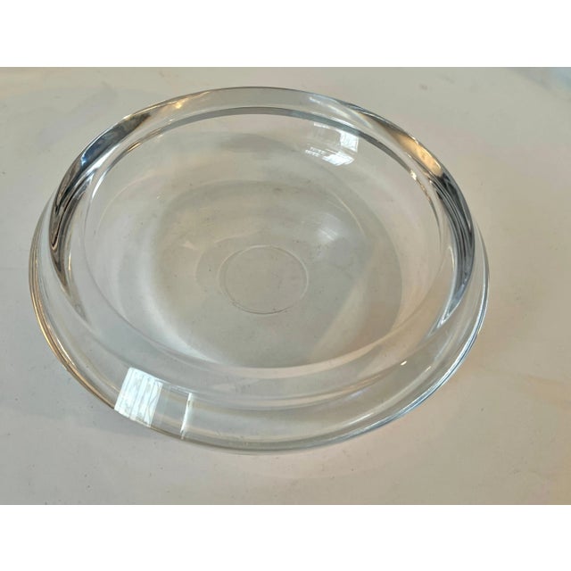 A large and very versatile glass bowl, dish, or ashtray. The piece is very thick and heavy and has a wonderful look....