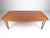 This unique Mid-Century Modern coffee table features stylish and sturdy Danish teak construction and is perfect for home...