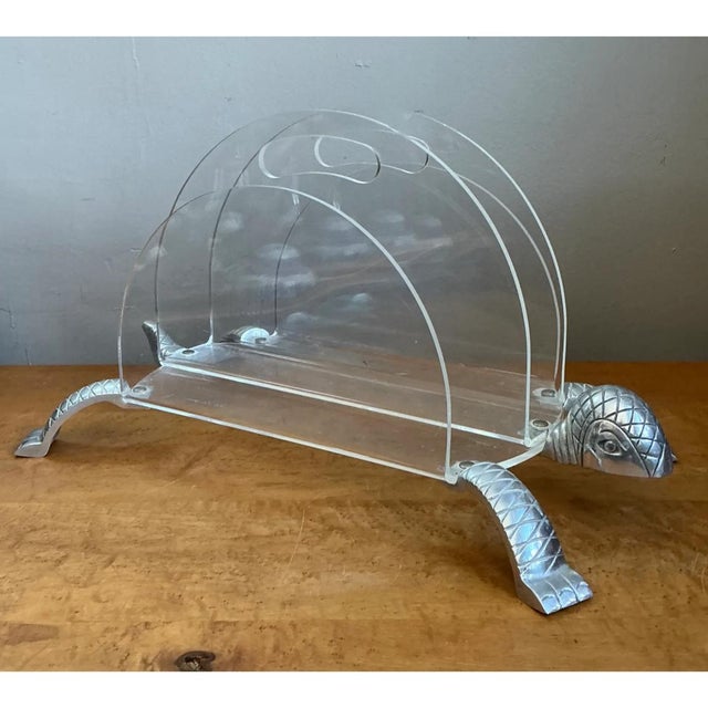 This vintage magazine rack is a witty piece of mid-century design, with a clear Lucite shell standing in for a turtle’s...