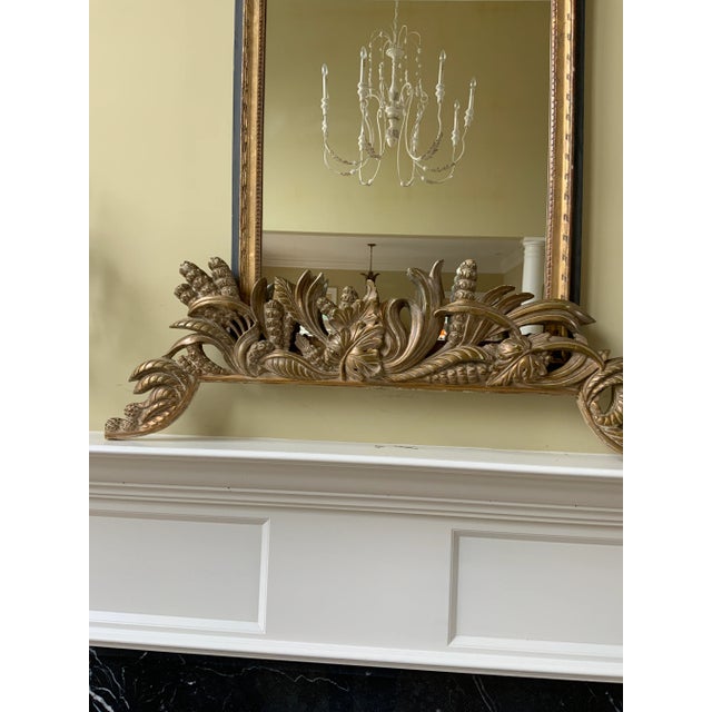 A beautiful large French gilt crest pediment of wheat, grapes, leaves and scrolls that is made of a wood composite and...