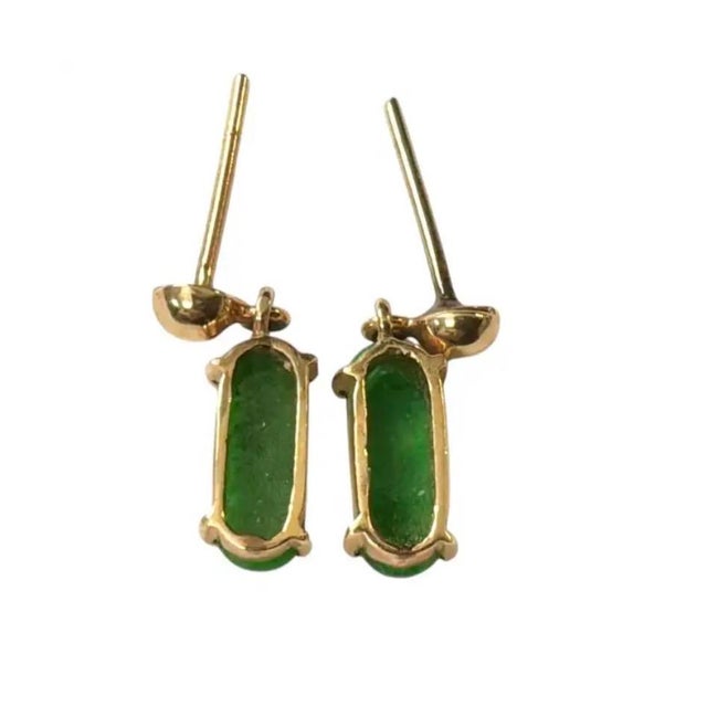 Vintage 14K Gold and Jadeite Drop Earrings. These earrings feature vibrant green gemstones set in 14K gold. The classic...