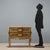 Small lacquered and painted wooden chest of drawers. Curved front and sides, two drawers, scroll-carved aprons underneath,...