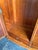 This magnificent Italian Neoclassical armoire is a masterwork of late 19th-century cabinetry, expertly crafted from richly...