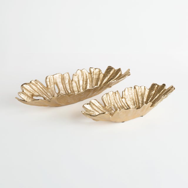 With its organic shape and deep ridges, these decorative oval bowls are an alluring accent. Made of cast aluminum with a...