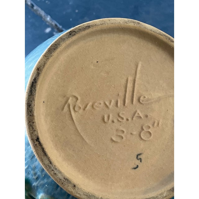 This exquisite vintage vase is a quintessential example of Roseville Pottery’s iconic "Clematis" line, introduced in 1945....