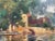 Stunning painting of a quaint bridge, building, and lush trees with dappled sunlight at the edge of a lake. Rich patina...