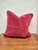 A striking set of two red velvet throw pillows, rich in color and luxuriously soft to the touch. The saturated red hue...