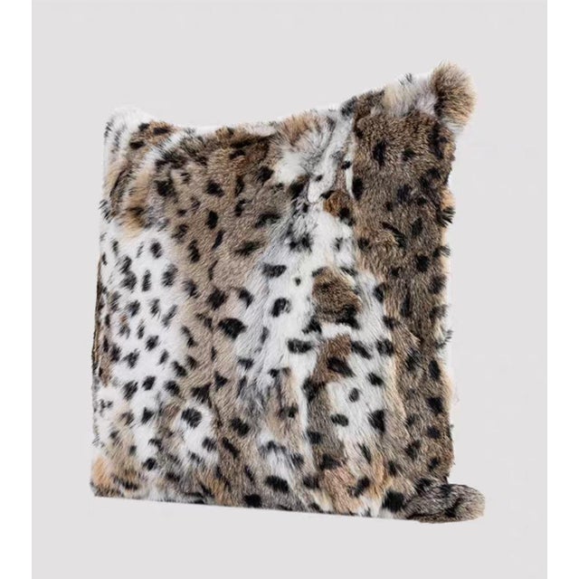 This square pillow restores the wild and dynamic beauty of nature with exquisite faux fur craftsmanship. The pillow...