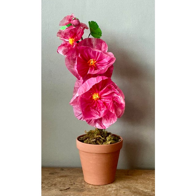 Contemporary hand-rolled paper flowers are a modern, artistic take on traditional floral arrangements. These flowers are...