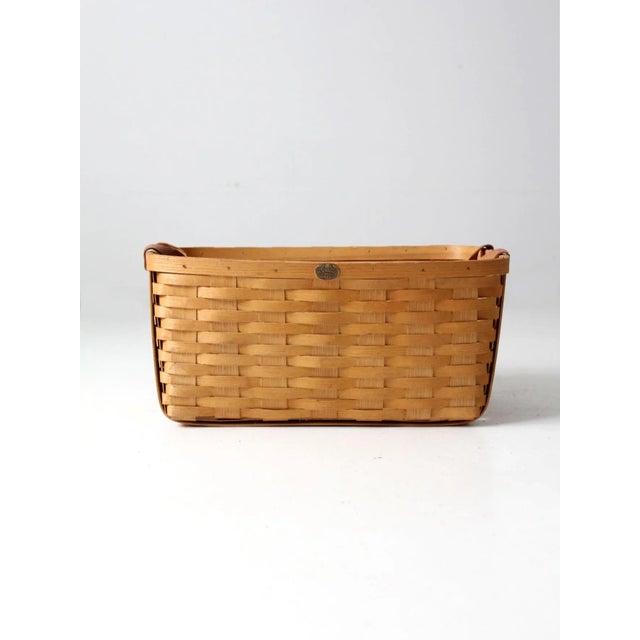This is a vintage Peterboro Basket Co storage basket. The large laundry tote features their classic splint weave with...