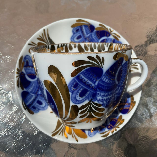 Lomonosov Cobalt Blue and Gold Demitasse Teacup and Saucer. It is in excellent condition and the cup measures 2 1/2”H x...