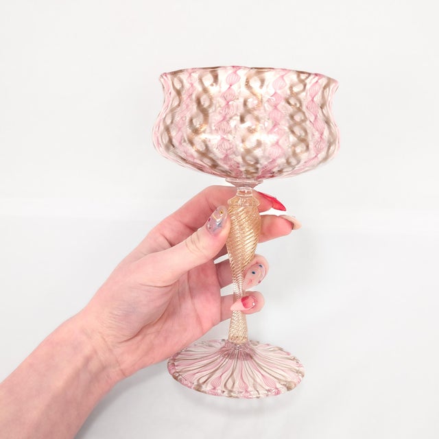A wonderful pair of Venetian glass champagne glasses or wine stems. Attributed to Salviati. Comprised of Zanfirico canes...
