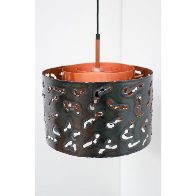 A striking brutalist pendant lamp by boréns, sweden, circa 1970s. thia sculptural sconce beautifully embody the bold...